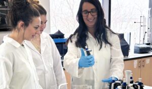 Environmental Technician professor Shandy demonstrates in the science lab