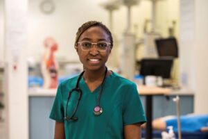 practical nursing student in scrubs in the nursing lab