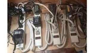 A series of power strips plugged into other power strips.