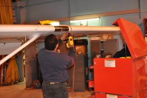 Aviation student working on a plane