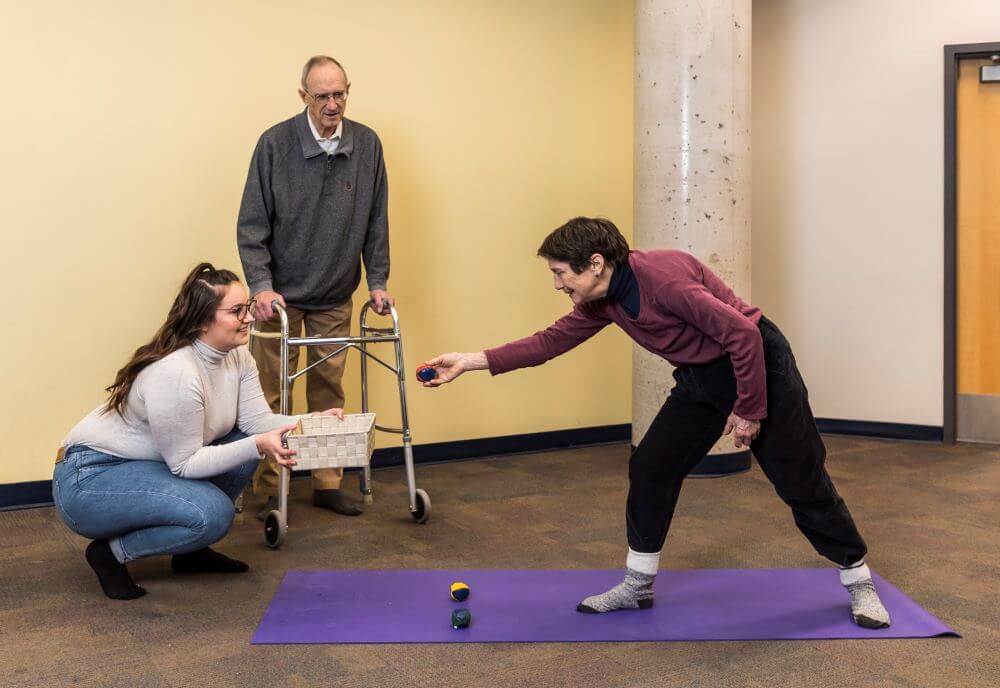 Therapeutic Recreation student working with clients on a mobility activity